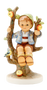 M.I. Hummel figurine HUM 142/I Apple Tree Boy featuring a young boy sitting in an apple tree with a small bird, handcrafted in Germany.