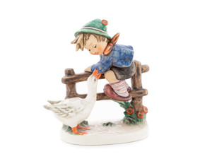 Close-up of the expressive face of the boy and the detailed feathers of the goose in the Barnyard Hero collectible.