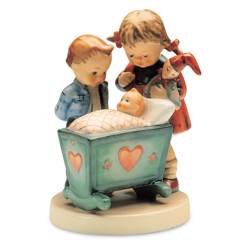 M.I. Hummel figurine HUM 333 Blessed Event featuring a big brother and sister looking at a newborn baby in a cradle, handcrafted in Germany.