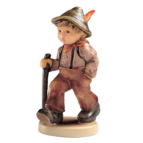 M.I. Hummel 'Grandpa’s Boy' (HUM 562) featuring a young boy in hiking gear with a wooden walking stick. A close-up of the textured hiking boots and the traditional feathered hat.