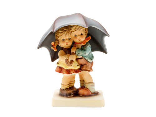 M.I. Hummel limited edition figurine HUM 634 Sunshower featuring a boy and girl huddled under a large umbrella, handcrafted in Germany.