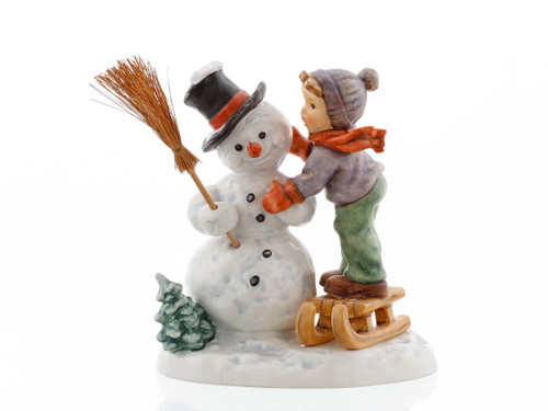 Making New Friends HUM 2002/0 M.I. Hummel figurine of a boy reaching out to a snowman.
