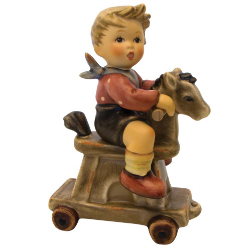 M.I. Hummel 'Riding Lesson' (HUM 2020) showing a toddler boy on a horse with wooden wheels.