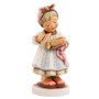 M.I. Hummel 'Bon Appetit' figurine HUM 2119 showing a girl chef with a kerchief and apron. Close-up of the apron and bowl details on the Bon Appetit chef figurine.