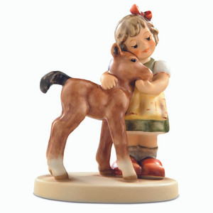M.I. Hummel 'Precious Pony' figurine HUM 2310 featuring a young girl hugging a small pony, nuzzling her chin. Close-up of the delicate hand-painted features and TMK-9 trademark on the Precious Pony porcelain collectible.