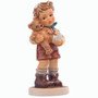 M.I. Hummel 'A Little Boo-Boo' (HUM 2334/B) showing a young boy holding a teddy bear with a bandaged foot.  A close-up of the boy’s concerned facial expression and the teddy bear’s "boo-boo."