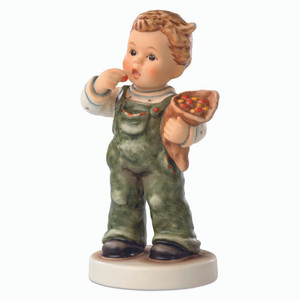 M.I. Hummel figurine HUM 2341 "Candy Cutie" featuring a boy with a traditional German candy cone.