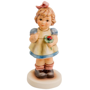 A Bit of Luck for You HUM 2307 M.I. Hummel Hope Series figurine for breast cancer awareness.