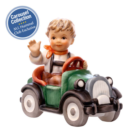 M.I. Hummel 'Beep Beep' (HUM 2291/C) featuring a boy in a red and white vintage racecar waving his hand. A close-up of the boy's enthusiastic expression and the classic "Beep Beep" detailing on the side of the carousel racecar.