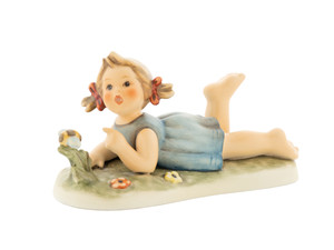 Close-up of the mischievous expression on the 10th Anniversary Hummel Miss Beehaving figurine.