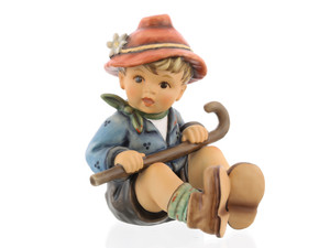 M.I. Hummel figurine HUM 2317/B "A Day for Fun" featuring a young hiker with a red hat and walking stick.