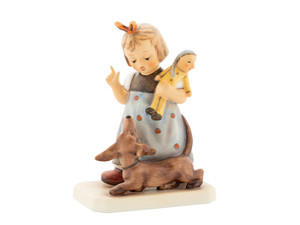 Close-up of the playful dachshund puppy on the M.I. Hummel 20th Anniversary Behave figurine.