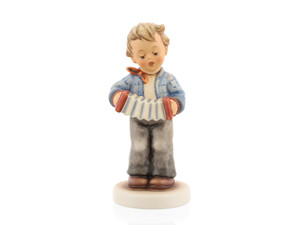 M.I. Hummel 'Making Music' figurine HUM 724 showing a boy in formal attire and a bow tie playing an accordion