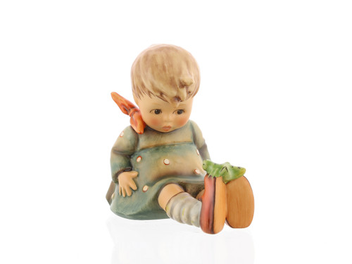 .I. Hummel 'Friend or Foe' figurine HUM 434 featuring a little girl looking at a grasshopper on her red shoe.