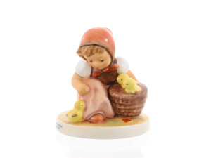 M.I. Hummel figurine HUM 57/0 Chick Girl featuring a young girl putting baby chicks into a basket, handcrafted in Germany since 1936.