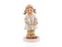 M.I. Hummel 'Comfort and Care' (HUM 2075) featuring a young girl nurse in a white medical coat and red slippers holding a syringe.  A close-up of the tiny hand-painted bandage at the nurse's feet and the caring, focused expression on her face.
