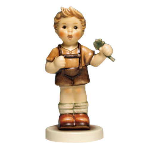 A Four-Leaf Clover HUM 2068/B M.I. Hummel Petite Favorite figurine of a boy in Lederhosen. Close-up of the hand-painted four-leaf clover held by the M.I. Hummel 2068/B boy.