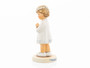 The traditional M.I. Hummel 'Peaceful Blessing' figurine (HUM 814) featuring a girl in a white dress holding a communion candle.
