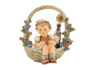 A Basket of Gifts Hum 618 M.I. Hummel Club 40th Anniversary redesigned figurine.
