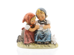 Original M.I. Hummel 'Easter Time' figurine (HUM 384) showing two girls snuggling with white bunnies.