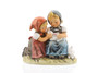 Original M.I. Hummel 'Easter Time' figurine (HUM 384) showing two girls snuggling with white bunnies.