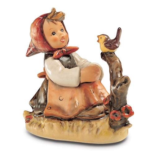 M.I. Hummel 'In Tune' figurine HUM 414 featuring a girl playing a recorder with a small bird sitting nearby. A close-up of the delicate hand-painted bird and the girl's recorder on the In Tune figurine.