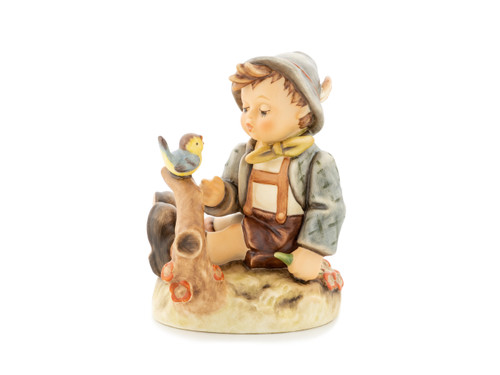 M.I. Hummel figurine HUM 413 Whistler’s Duet, featuring a young boy holding a whistle and looking at a small bird, handcrafted in Germany
