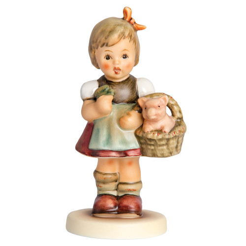 Good Luck Charm HUM 2034 M.I. Hummel figurine of a girl holding a clover with a pig in her basket. Close-up of the lucky piglet and four-leaf clover on the M.I. Hummel Good Luck Charm figurine.