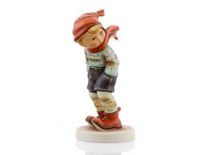 "M.I. Hummel March Winds HUM 43/0 porcelain figurine of a boy in a wind-whipped scarf, perfect for March birthday gifts.