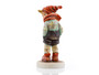 M.I. Hummel figurine HUM 43/0 March Winds featuring a young boy leaning into the wind with a flying scarf, handcrafted in Germany.