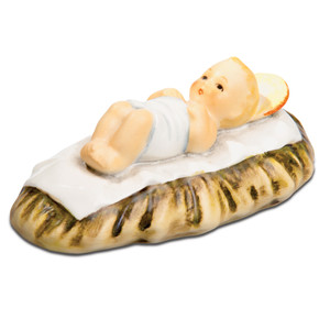 Infant Jesus HUM 214/A/K/0 M.I. Hummel Nativity figurine of Christ Child in a manger. Close-up of the sweet smiling face of the M.I. Hummel Infant Jesus in his manger.