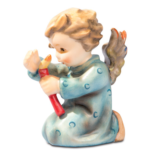 Shining Light HUM 358 M.I. Hummel kneeling angel figurine shielding a candle with one hand. Close-up of the reverent face and protective hand gesture on the M.I. Hummel Shining Light angel.
