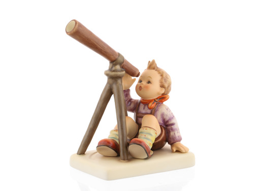 M.I. Hummel 'Star Gazer' figurine HUM 132 showing a young boy sitting on a stool looking through a telescope.