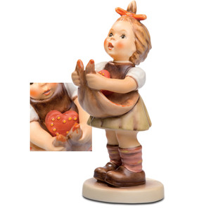 A close-up of the hopeful facial expression and hand-painted floral details on the Will You Be Mine collectible.