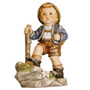 M.I. Hummel 'Trail Blazer' figurine HUM 2045 showing a young boy hiker with a backpack and walking stick.
Detail of the hand-painted edelweiss flower and blue hat feather on the Trail Blazer Hummel.