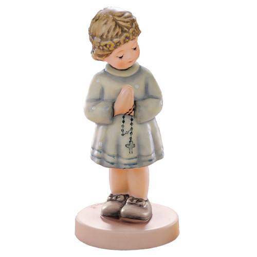 M.I. Hummel 'Peaceful Blessing' European Version (HUM 814) featuring a girl in a communion dress holding a candle. Close-up of the girl's serene expression and the hand-painted communion candle.