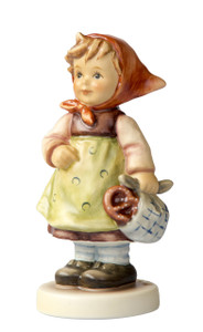 Festival Journey HUM 2380 M.I. Hummel figurine of a girl in Bavarian costume holding a pretzel. Close-up of the hand-painted pretzel and red headscarf on the M.I. Hummel Festival Journey figurine