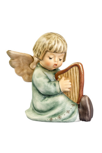 M.I. Hummel 'Song of Praise' figurine HUM 454 featuring a petite angel playing a harp with gold-dipped wings. Close-up showing the 15-color paintwork and the precision detail of the angel's fingers on the harp strings.