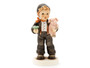 M.I. Hummel figurine HUM 2375 Feelin' Lucky featuring a chimney sweep holding a lucky pig and a shamrock, handcrafted in Germany with intricate 3D shading.