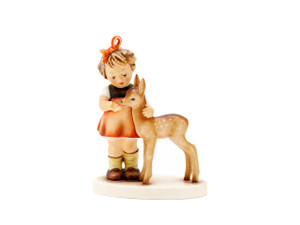 Classic M.I. Hummel figurine HUM 136 of a girl with a light brown fawn.