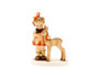Classic M.I. Hummel figurine HUM 136 of a girl with a light brown fawn.