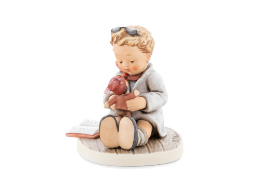 M.I. Hummel 'You’ll Be Fine' (HUM 926) featuring a young boy doctor holding a medical book and a remedy can.