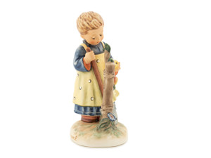 M.I. Hummel figurine HUM 461 In the Orchard featuring a young gardener inspecting a harvest apple, handcrafted in Germany.