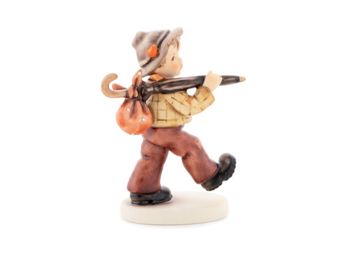 Limited Edition M.I. Hummel figurine HUM 908 of a boy hiker with a heart on his hat.