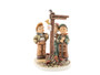 M.I. Hummel Masterpiece figurine HUM 927 of three boys at a signpost.