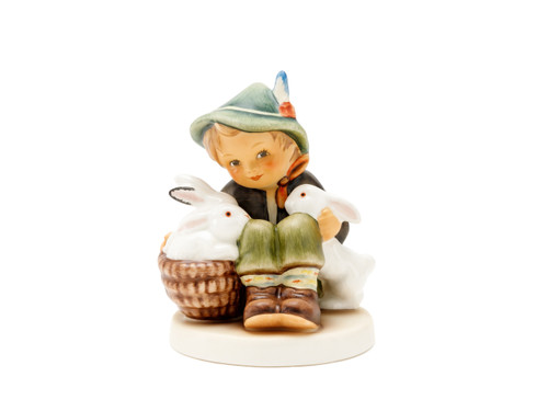 M.I. Hummel 'Playmates' figurine HUM 58/2/0 featuring a young boy sitting with three white rabbits and a brown basket