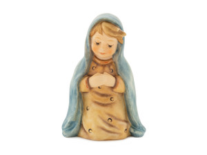 Close-up of the serene face and blue cloak on the M.I. Hummel Mary Nativity figurine.