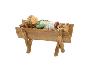 Close-up of the hand-painted swaddling clothes and peaceful face of the M.I. Hummel Infant Jesus.