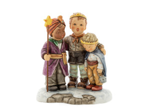 M.I. Hummel figurine HUM 2412 Carolers featuring three children singing Christmas carols, including a sleepy boy named Caspar, handcrafted in Germany.