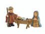 The Holy Family HUM 2230 ensemble featuring Mary, Joseph, and Baby Jesus M.I. HUMMEL figurines.